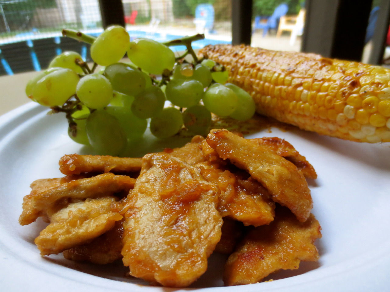 Spicy grilled corn on the cob with meatless chicken and grapes.More at secretsofanamateurchef.tumblr.com