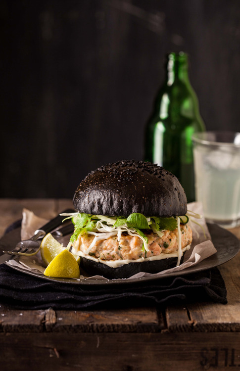 Salmon Burger On A Black Brioche BunSource